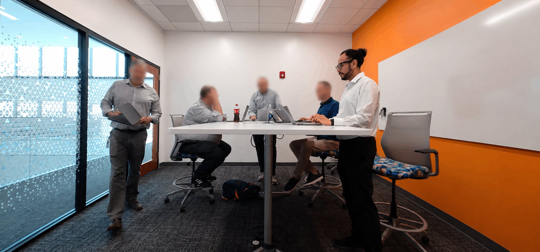 Ullas Das in an enterprise team working session, with other faces blurred